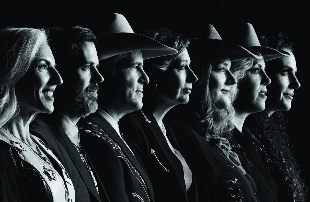 The Duttons in a dramatic black-and-white family cast portrait.