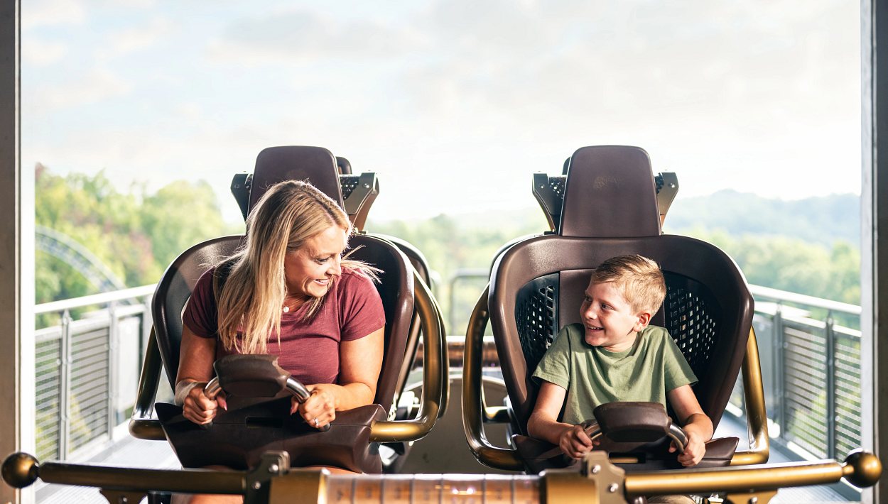 A parent and child enjoying Time Traveler at Silver Dollar City.